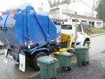 One of the Wrangell's new garbage trucks along with the cans.